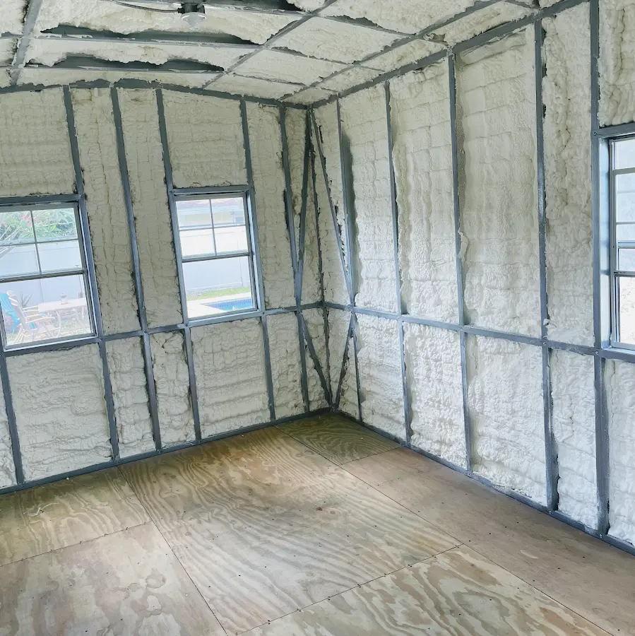 Closed-cell spray foam insulation applied to wall cavities in a residential project in Hazelwood